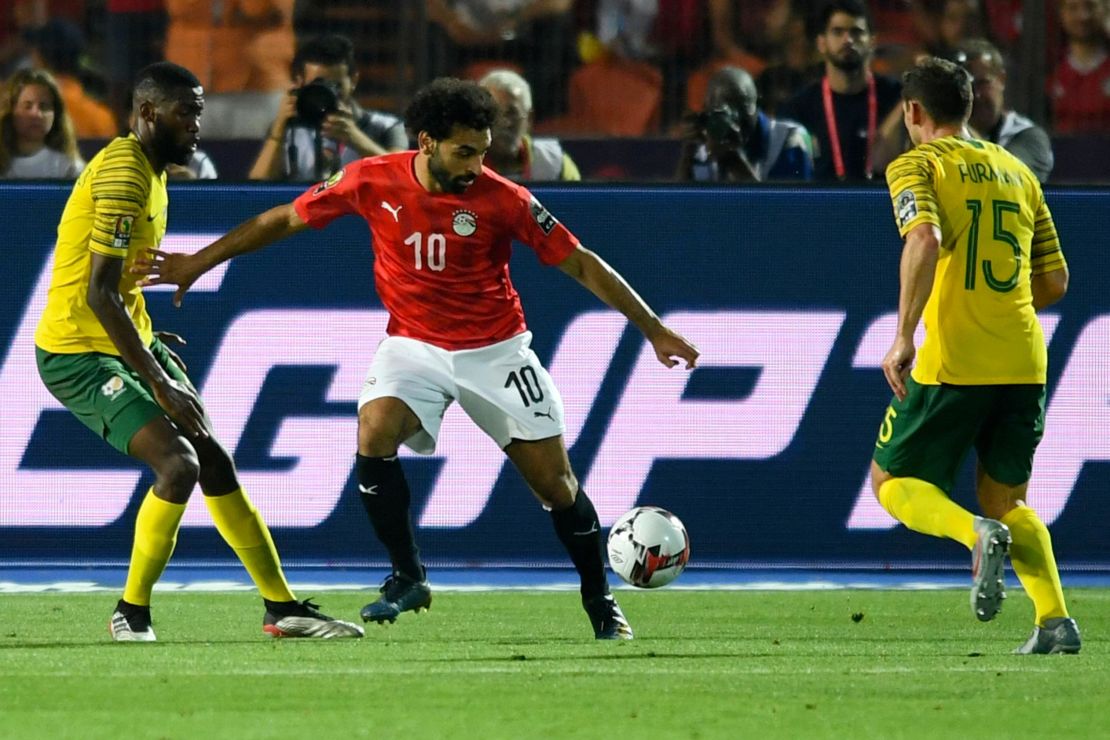 Mohamed Salah is marked by South Africa's midfielder Dean Furman (R) during the 2019 Africa Cup of Nations (CAN) Round of 16 football match between Egypt and South Africa.