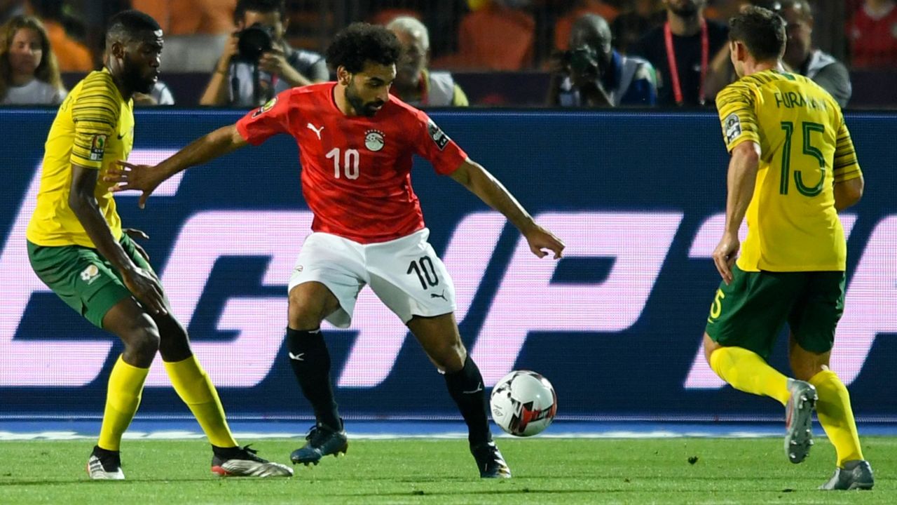 Mohamed Salah is marked by South Africa's midfielder Dean Furman (R) during the 2019 Africa Cup of Nations (CAN) Round of 16 football match between Egypt and South Africa.