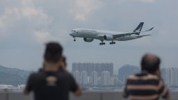 A Cathay Pacific passenger plane makes its descent before landing at Hong Kong's international airport on August 16, 2017.
The city's flagship airline Cathay Pacific was expected to announce its half-year results later in the day. / AFP PHOTO / Anthony WALLACE        (Photo credit should read ANTHONY WALLACE/AFP/Getty Images)