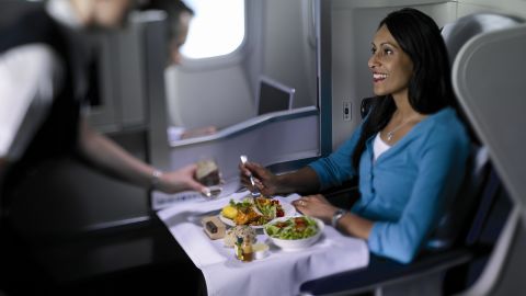 British Airways cabin crew serve a Club World customer.