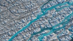 Rivers of meltwater carve into the Greenland ice sheet near Sermeq Avangnardleq glacier on August 4, 2019 near Ilulissat, Greenland. 