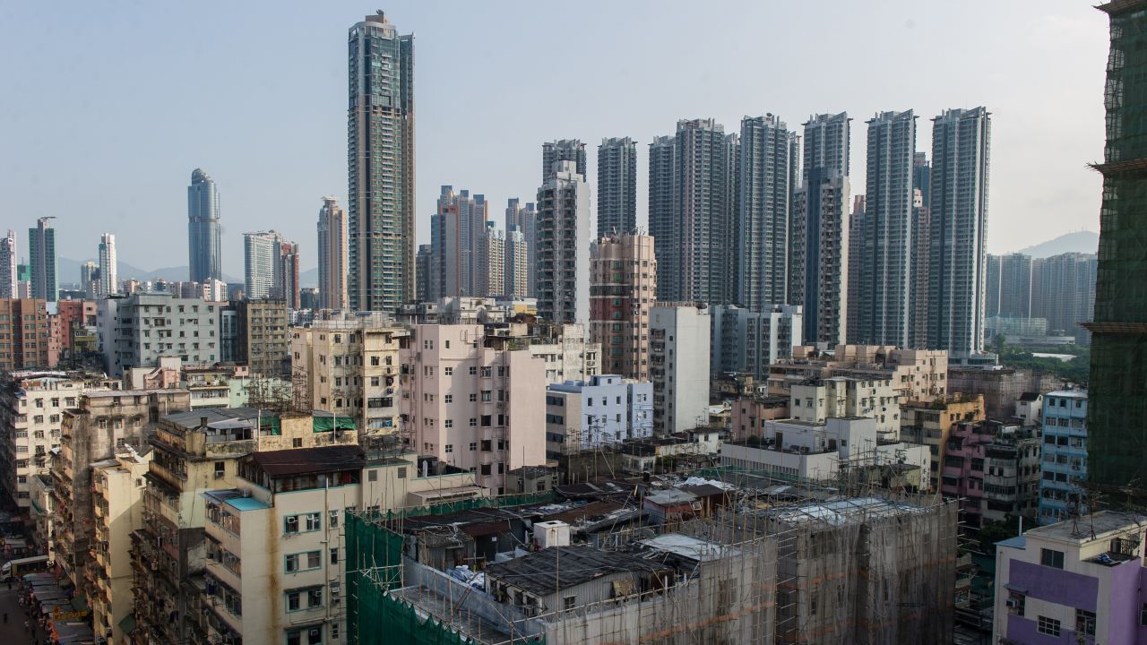 TO GO WITH HongKong-housing-social-rooftop,FEATURE by Laura MANNERING
This photograph taken on October 10, 2013 shows the residential building (bottom C) upon which residents Su Xingyun and Quang Xuan live in their rooftop houses in the Sham Shui Po district of Hong Kong.   Their precarious rooftop houses have for years offered refuge from an unaffordable Hong Kong property market, but some of the city's poorest residents now face losing their makeshift homes as the government seeks to dismantle them.       AFP PHOTO / ANTHONY WALLACE        (Photo credit should read ANTHONY WALLACE/AFP/Getty Images)