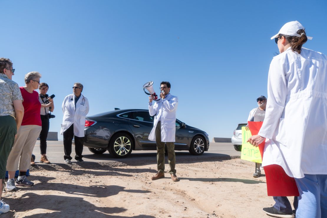 Dr. Pritesh Gandhi addresses doctors, nurses and medical students gathered at the Tornillo Port of Entry in June 2018 in Tornillo, Texas, to demand an end to separation of immigrant children from their parents. (Photo by Paul RATJE / AFP) 