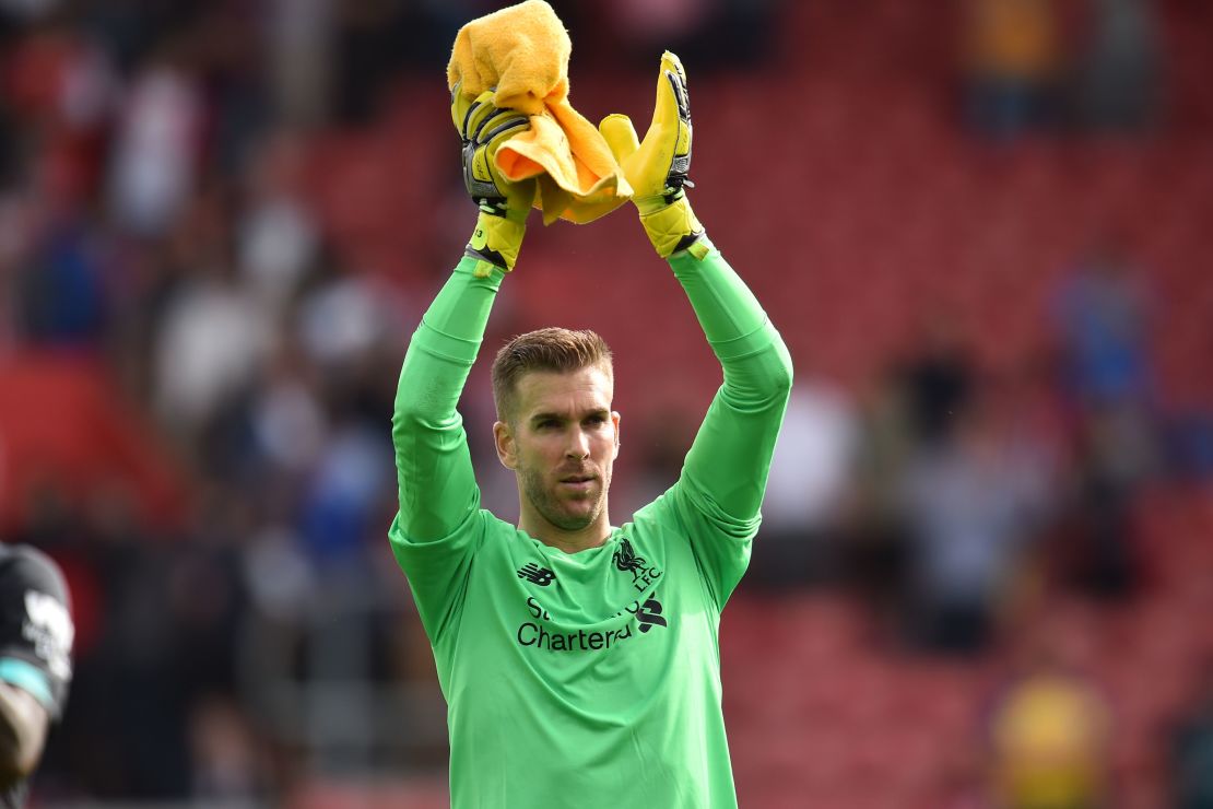 Spanish goalkeeper Adrian applauds Liverpool's supporters after the 2-1 win over Southampton.