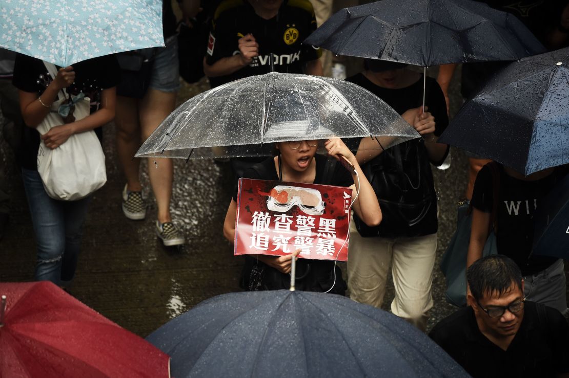 Protesters walk along a street during a rally in Hong Kong on August 18, 2019, in the latest opposition to a planned extradition law.