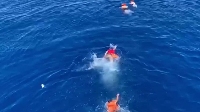migrants attempt swim island italy lampedusa pkg vpx_00011004.jpg