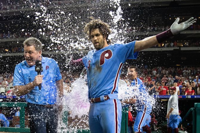 Philadelphia Phillies right fielder Bryce Harper is doused with water after hitting a walk-off grand slam in the ninth inning during a game against the Chicago Cubs in Philadelphia on Thursday, August 15.