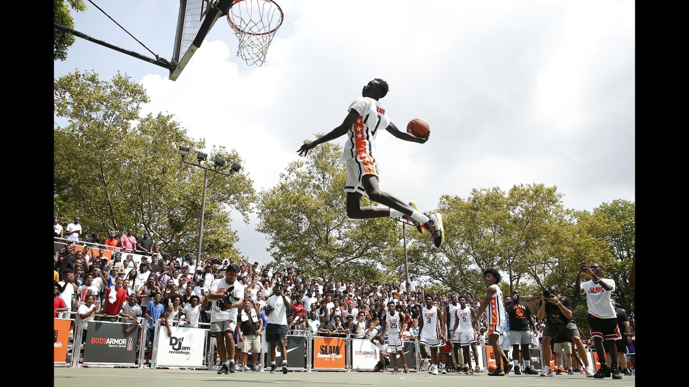 Jimma Gatwech of Team Jimma dunks prior to the SLAM Summer Classic at Dyckman Park in New York City on Sunday, August 18.
