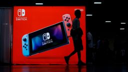 LAS VEGAS, NEVADA - AUGUST 02: Attendees walk by the Nintendo booth during day one of the 2019 Evolution Championship Series at Mandalay Bay Resort and Casino on August 02, 2019 in Las Vegas, Nevada. (Photo by Joe Buglewicz/Getty Images)