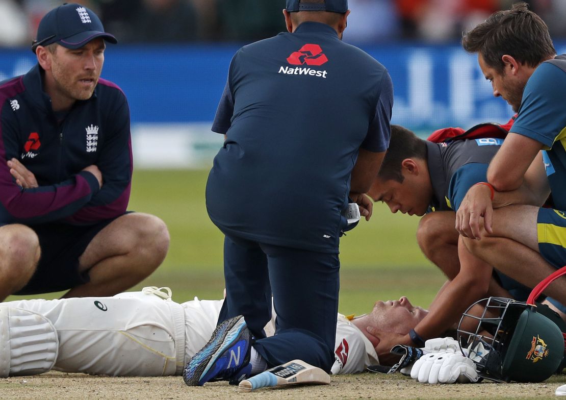 Smith lays on the pitch after being hit in the head by Jofra Archer.