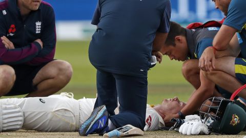 Smith lays on the pitch after being hit in the head by Jofra Archer.