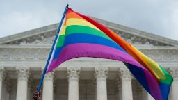 A rainbow flag is flown outside the Supreme Court in Washington, DC on June 26, 2015 after its historic decision on gay marriage. 