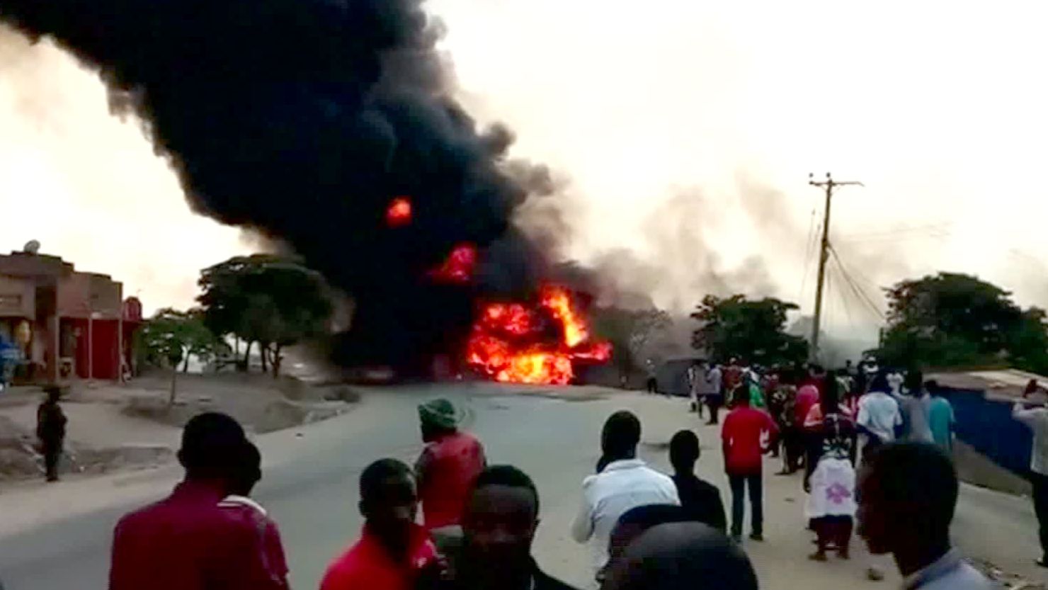 Flames and dense smoke rise from the scene of Sunday's explosion in Uganda.