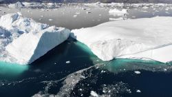 Two icebergs broken off from Helheim glacier collide in Sermilik Fjord in Eastern Greenland.
