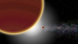 At least two giant planets, aged 20 million years at most, orbit around the star (which is hidden): β Pictoris c, the nearest one, which has just been discovered, and β Pictoris b, which is more distant. The disk of dust and gas can be seen in the background.