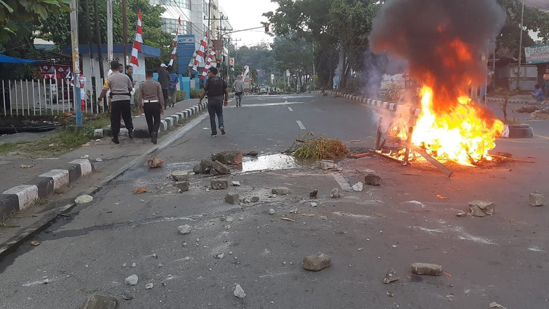 Protesters set fire to cars, tires, and the local parliament building in Manokwari.