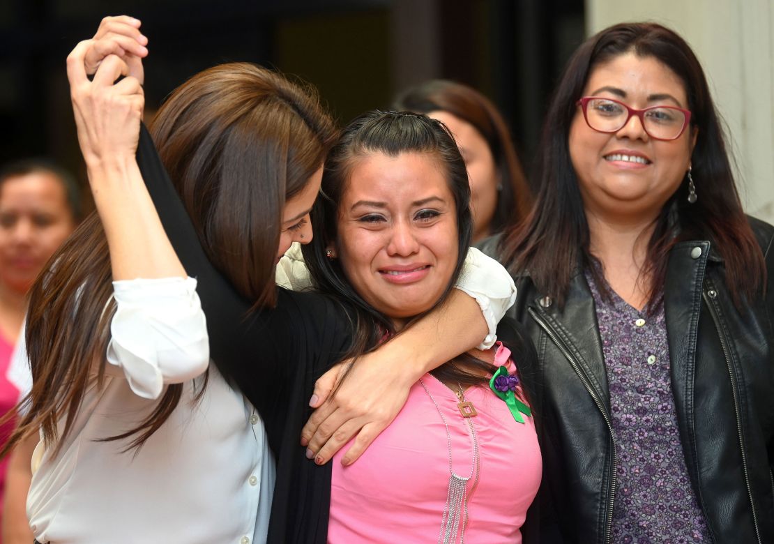Salvadorean rape victim Evelyn Hernandez (C) celebrates with her lawyers after being cleared of murder after giving birth to a stillborn baby at home in 2016, at Ciudad Delgado's court in San Salvador on August 19, 2019. El Salvador has an extremely strict abortion ban.