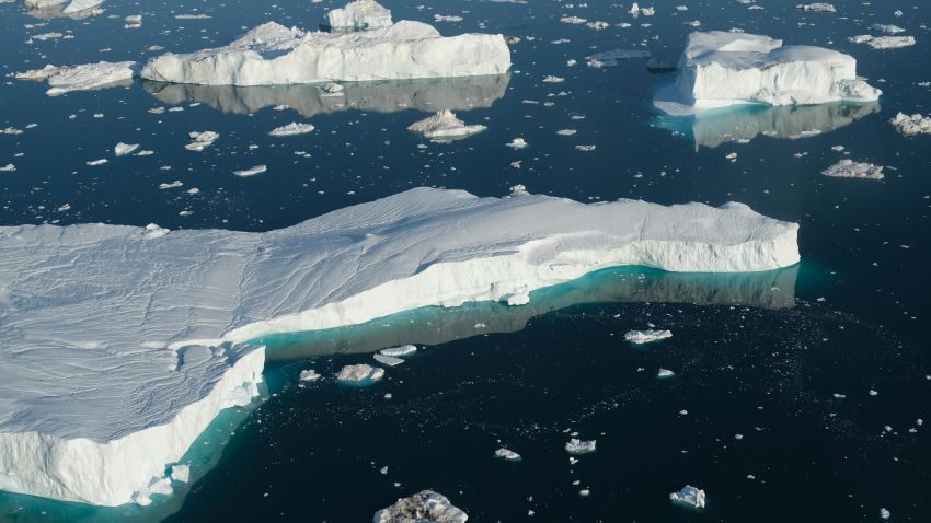ILULISSAT, GREENLAND - AUGUST 04: In this view from an airplane icebergs float at the mouth of the Ilulissat Icefjord on August 04, 2019 near Ilulissat, Greenland. The Sahara heat wave that recently sent temperatures to record levels in parts of Europe has also reached Greenland. Climate change is having a profound effect in Greenland, where over the last several decades summers have become longer and the rate that glaciers and the Greenland ice cap are retreating has accelerated.   (Photo by Sean Gallup/Getty Images)