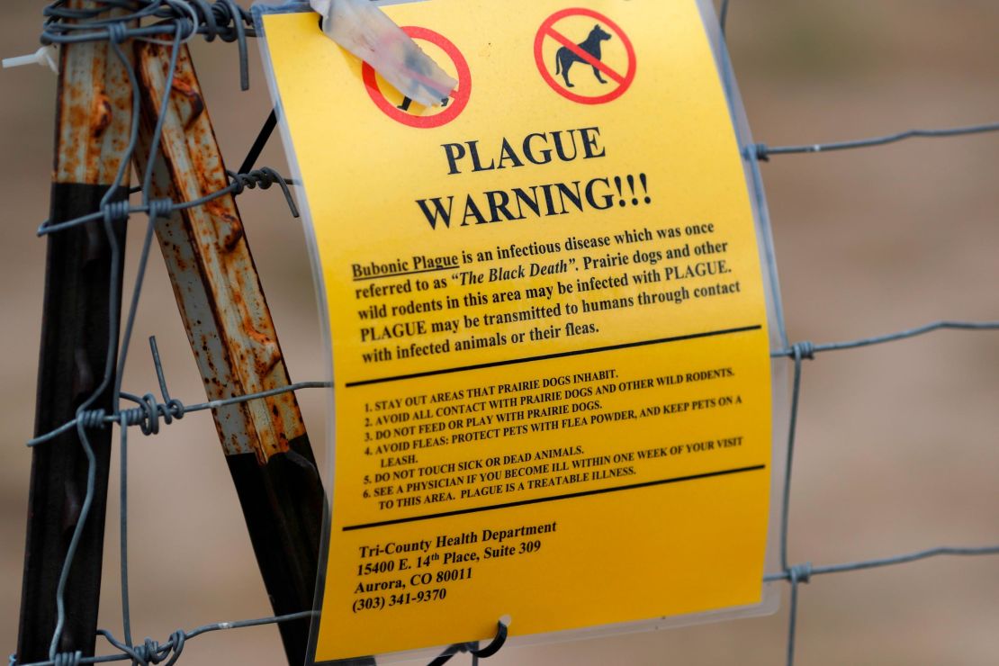 A sign warns of the plague at a parking lot near the Rocky Mountain Arsenal Wildlife Refuge in Commerce City, Colorado.