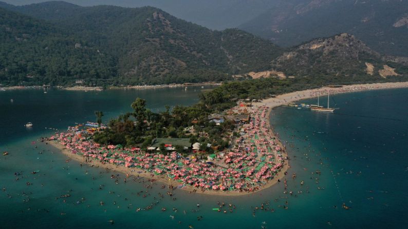 <strong>Ölüdeniz, Turkey:</strong> It's hard to fault the natural delights of Ölüdeniz: White sands, blue lagoon, the lushly covered Babadağ mountain. The trouble is, a lot of other people have discovered it too. <br />