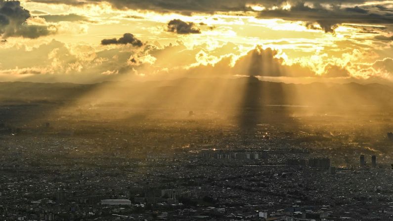 <strong>Bogota:</strong> Golden light streams down on the Colombian capital in this shot taken from top of Monserrate hill. 