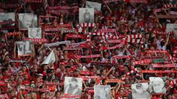 FC Union Berlin's fans show their scarves and pictures of fans who have passed away prior to their match against RB Leipzig in Berlin.