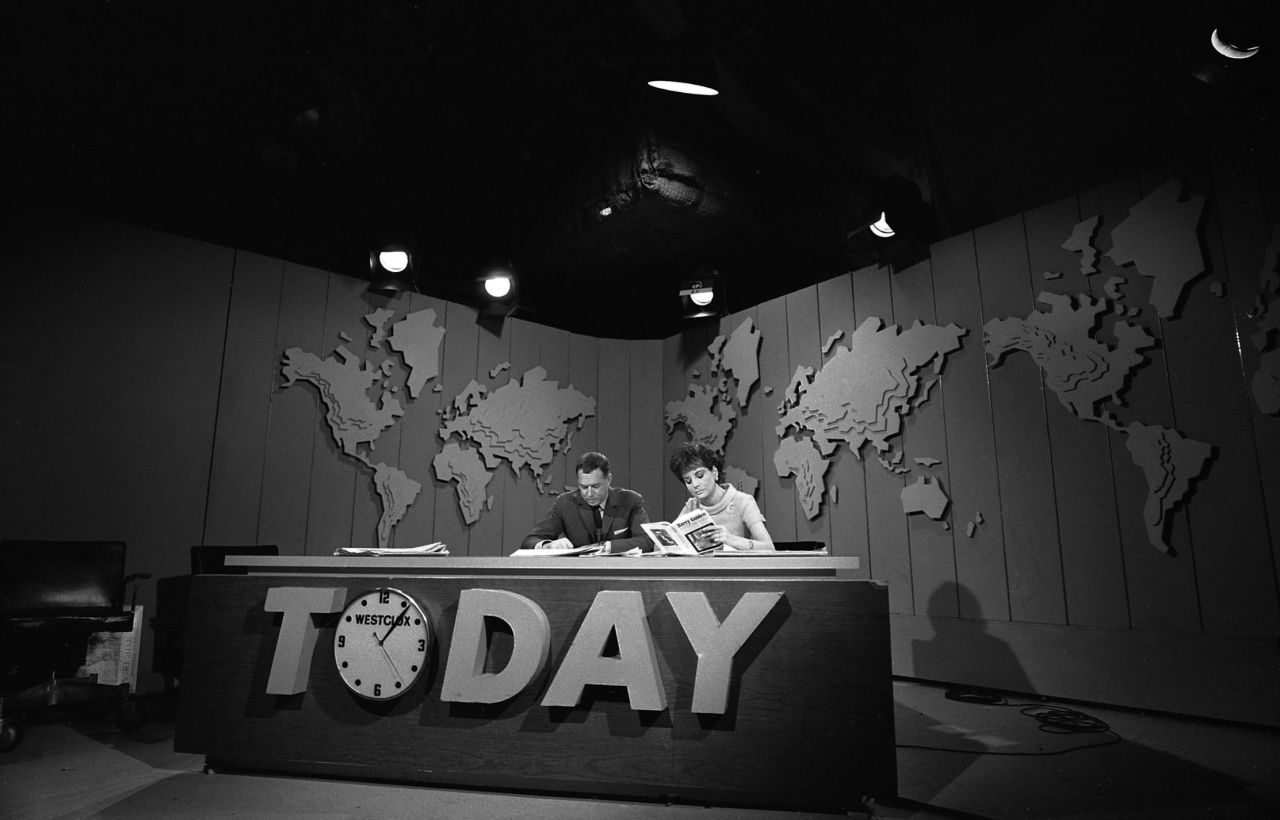 Walters and Hugh Downs sit at the "Today" show desk in 1966. The two worked together for much of their career.