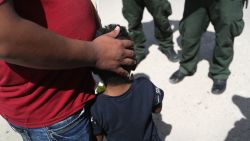 U.S. Border Patrol agents take a father and son from Honduras into custody near the U.S.-Mexico border on June 12, 2018 near Mission, Texas. The asylum seekers were then sent to a U.S. Customs and Border Protection (CBP) processing center for possible separation. U.S. border authorities are executing the Trump administration's zero tolerance policy towards undocumented immigrants.