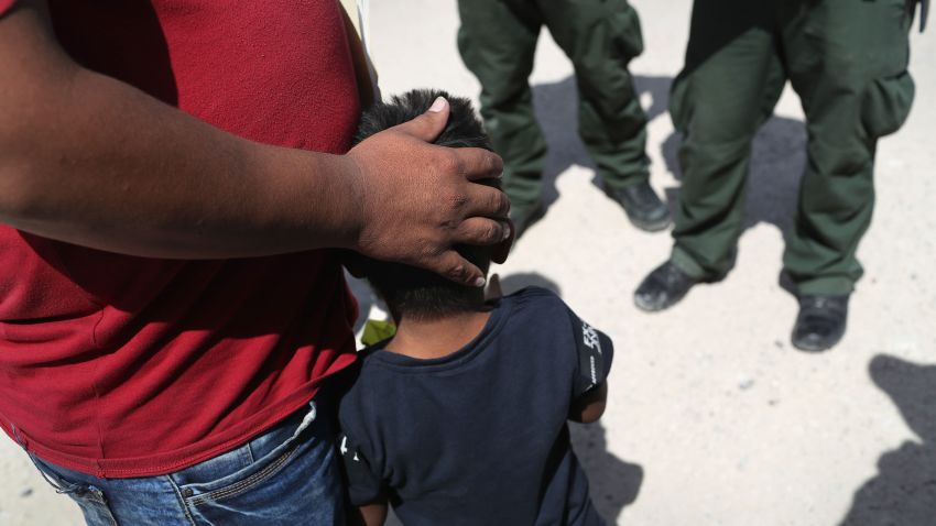 U.S. Border Patrol agents take a father and son from Honduras into custody near the U.S.-Mexico border on June 12, 2018 near Mission, Texas. The asylum seekers were then sent to a U.S. Customs and Border Protection (CBP) processing center for possible separation. U.S. border authorities are executing the Trump administration's zero tolerance policy towards undocumented immigrants. 