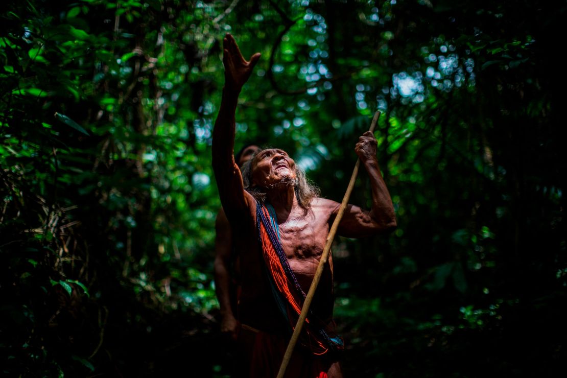Ororiwa Waiapi walks in the forest near Mogywry village, in Amapa state. The 98-year-old leader is one of the tribe's eldest chiefs.