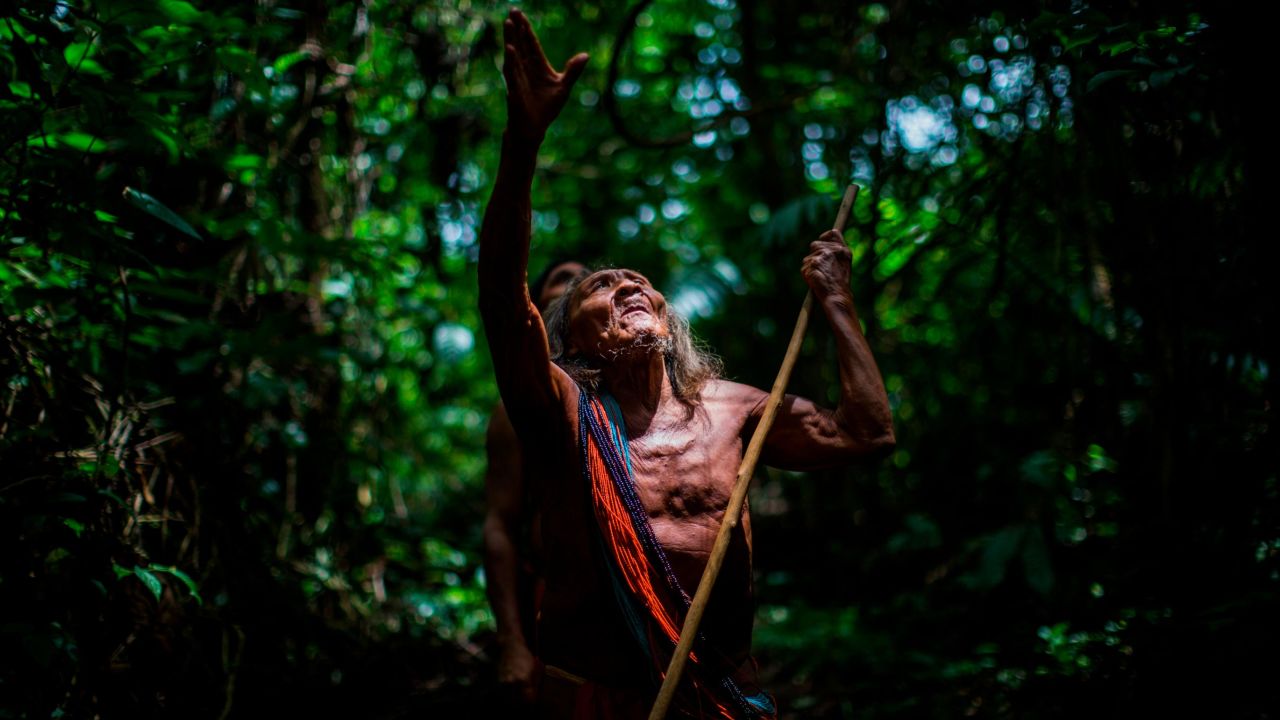 Ororiwa Waiapi walks in the forest near Mogywry village, in Amapa state. The 98-year-old leader is one of the tribe's eldest chiefs.