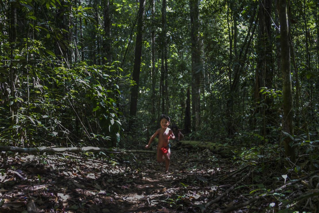 A young Ruwan Waiapi plays in the jungle. Her father, Jawaruwa Waiapi, testified before the United Nations in New York to ask for international support for Brazil's Amazon and the indigenous tribes that live in it.