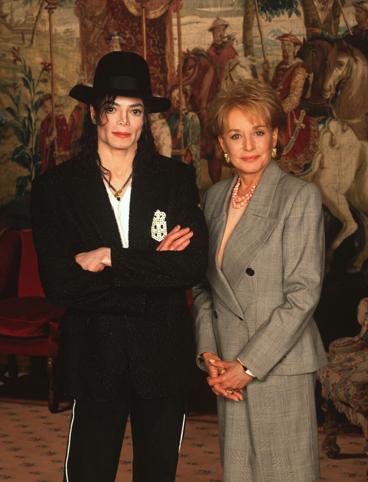 Walters takes a photo with singer Michael Jackson, whom she interviewed in 1997.