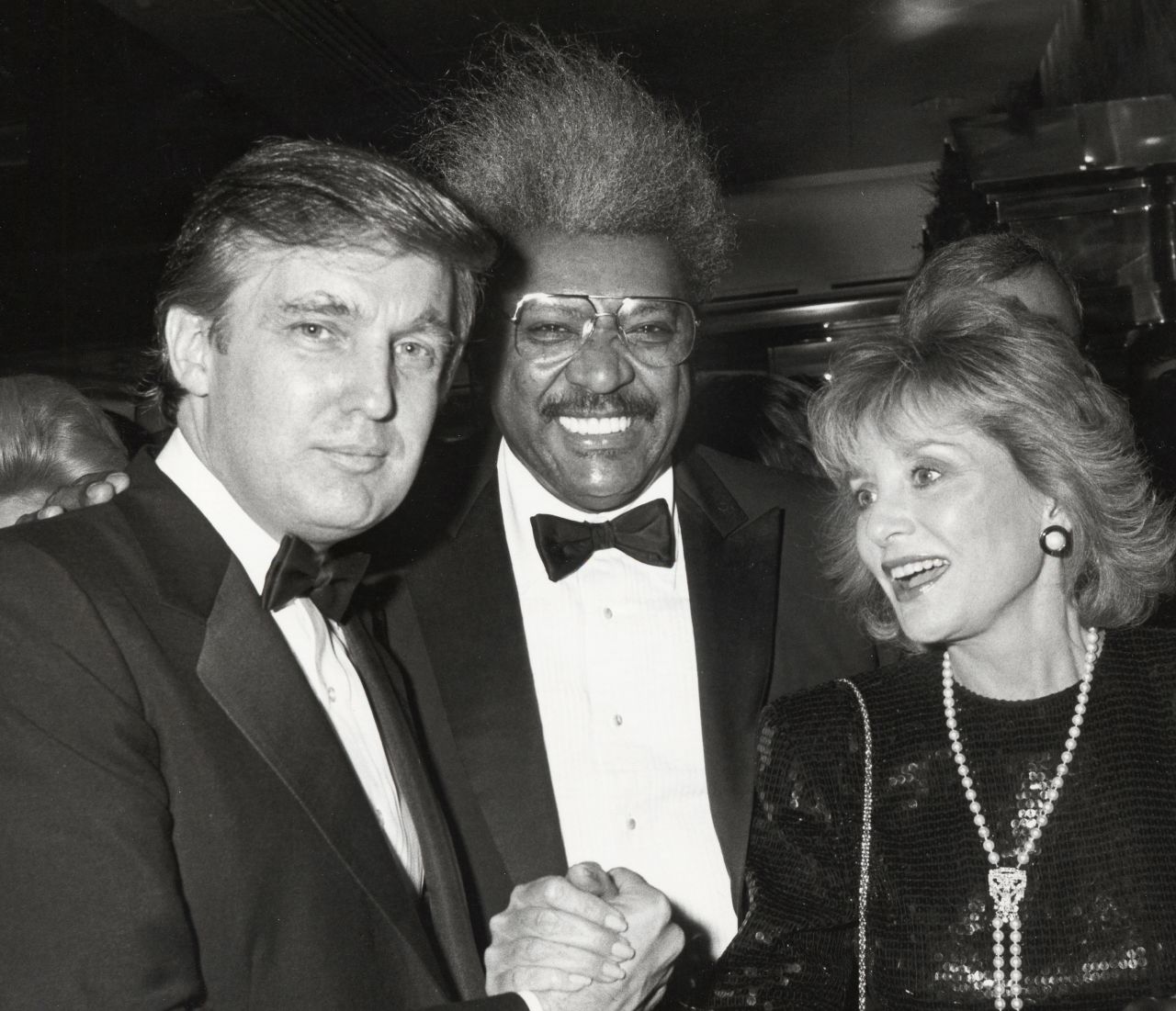 Walters is photographed with Donald Trump and Don King in 1987.