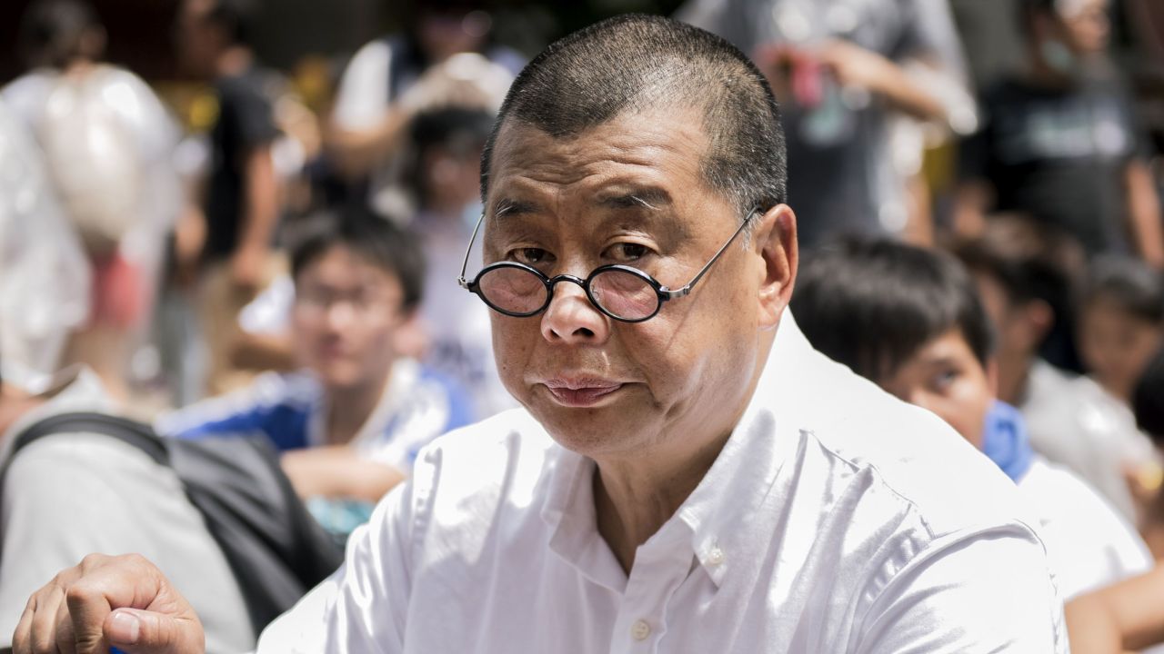 Hong Kong media tycoon and pro-democracy supporter Jimmy Lai attends a rally near the government headquarters in Hong Kong on September 28, 2014. Activists massed outside Hong Kong's government headquarters on September 28, vowing to keep up an increasingly tense civil disobedience campaign unless Beijing grants more political freedoms.  AFP PHOTO / ALEX OGLE        (Photo credit should read Alex Ogle/AFP/Getty Images)