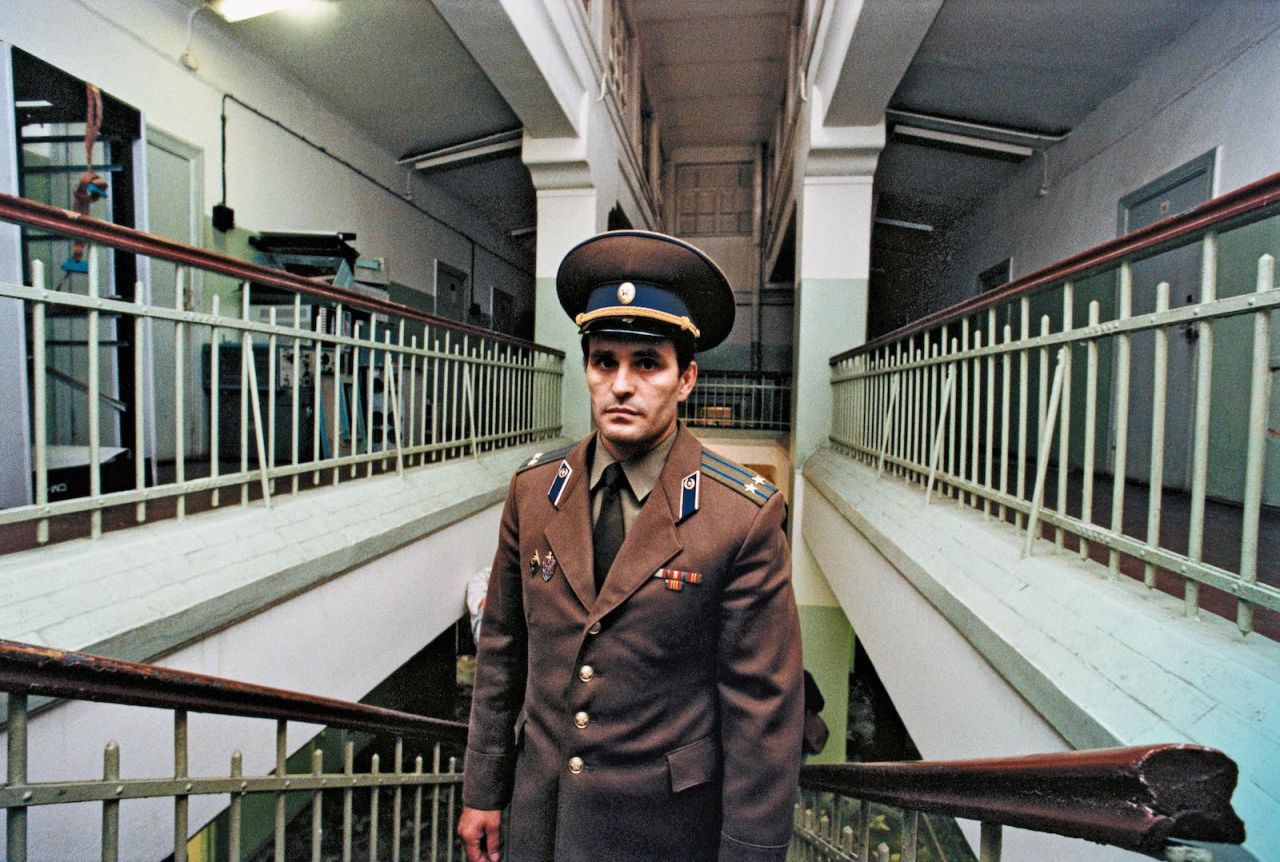 A KGB colonel in front of vacant cells at the Lubyanka prison in Moscow. 