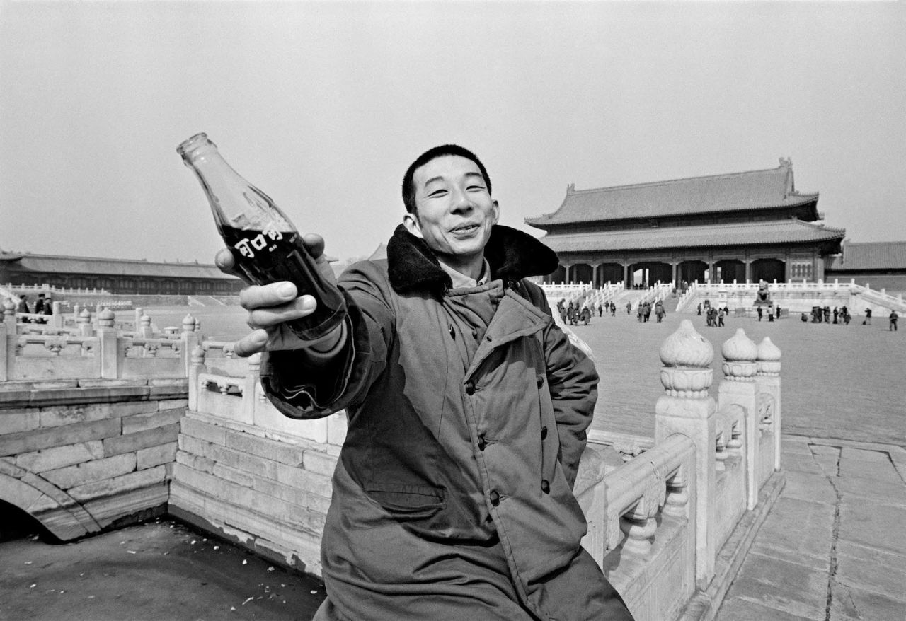 A young man with a Coca-Cola in 1981, shortly after  the company resumed production in China.