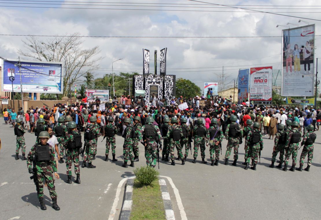 Indonesian soldiers stand guard during a protest in Timika in Papua province Wednesday.