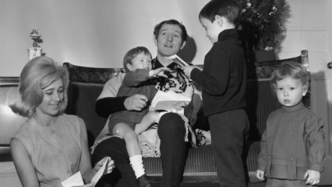 Irish actor Richard Harris opens Christmas cards at home with his wife Elizabeth and their sons Jared, Damian, and Jamie in this photo dated December 19, 1964.