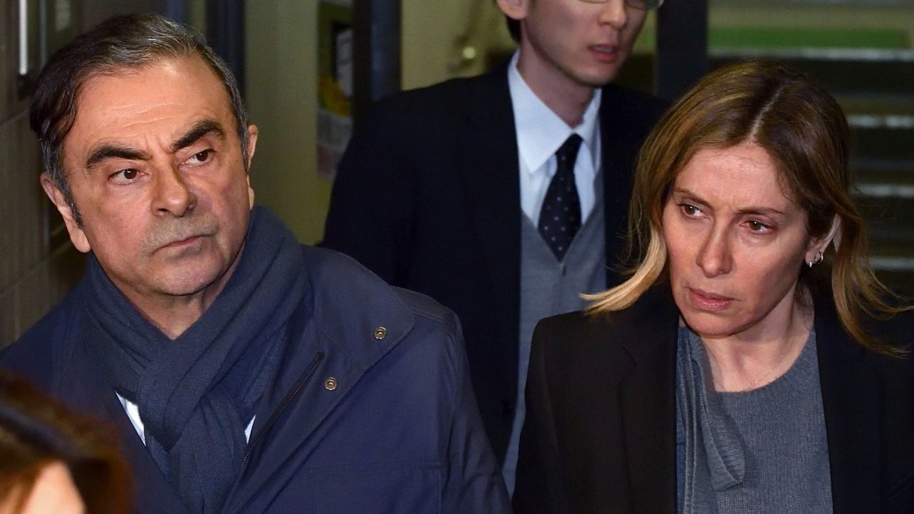 Carlos Ghosn and Carole Ghosn leaving his lawyer's office in Tokyo in April.