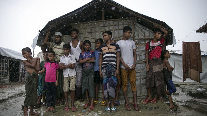 COX'S BAZAR, BANGLADESH - AUGUST 21: Rohingya are seen during a rainstorm at the Nayapara refugee camp on August 21, 2019 in Cox's Bazar, Bangladesh. Rohingya refugees said on August 21st that they did not want to return to Myanmar without their rights and citizenship, with repatriation set to start on August 22nd. August 25th marks the second anniversary of the Rohingya crisis in Bangladesh after Myanmar's military crackdown on the ethnic Muslim minority forced over 700,000 to flee to Bangladesh from violence and torture. The United Nations has stated that it is a textbook example of ethnic cleansing. (Photo by Allison Joyce/Getty Images)