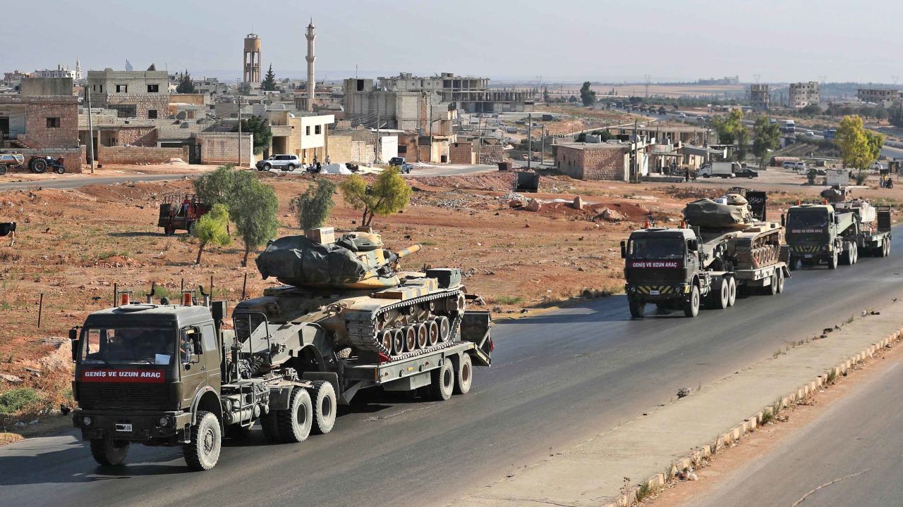 A convoy of Turkish military vehicles passes through the town of Saraqeb in Idlib province on August 19, 2019.
