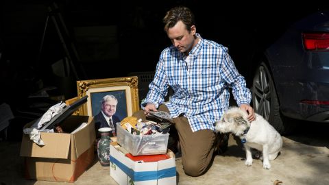 Kyle Haines and his dog Paddi visit their gutted home after in November 2017.