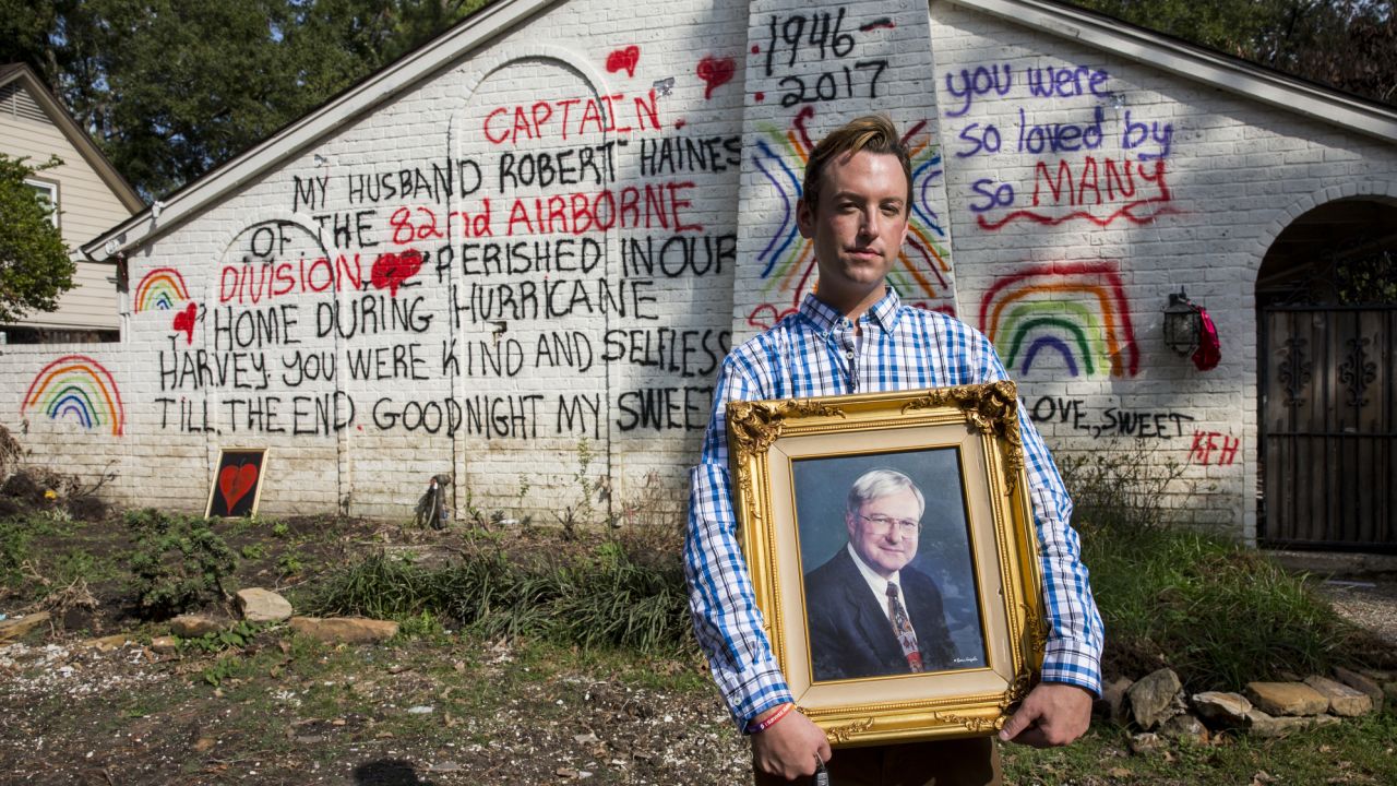 Kyle Haines stands in front of the remains of his house holding a photograph of his late husband Bob Haines, who died in their home during the flooding after Hurricane Harvey, in Houston, TX on Thursday, November 2, 2017. (Photo/Scott Dalton)