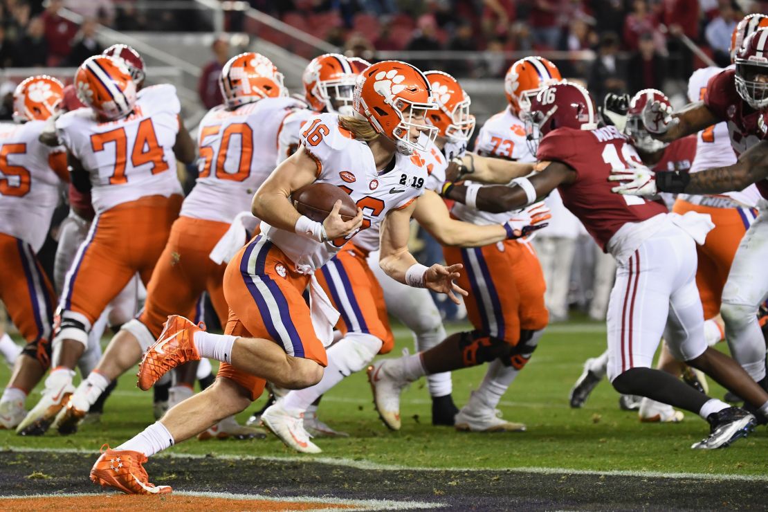 Trevor Lawrence (#16) of the Clemson Tigers takes off against the Alabama Crimson Tide in the CFP National Championship game.