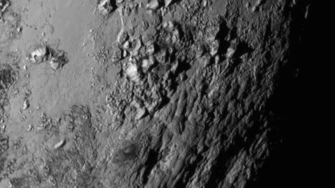 IN SPACE - JULY 14: In this handout provided by the National Aeronautics and Space Administration (NASA), a close-up image of a region near Pluto's equator shows a range of mountains rising as high as 11,000 feet (3,500 meters) taken by NASA's New Horizons spacecraft as it passed within 7,800 feet of the dwarf planet on July 14, 2015. The 1,050-pound piano sized probe, which was launched January 19, 2006 aboard an Atlas V rocket from Cape Canaveral, Florida, zipped by the planet yesterday. (Photo by NASA/APL/SwRI via Getty Images)