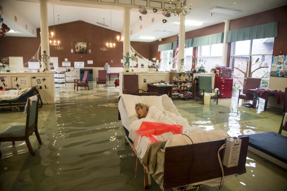 An elderly patient waits to be rescued from the Gulf Health Care Center in Port Arthur. The facility was evacuated with the help of first responders and volunteers.