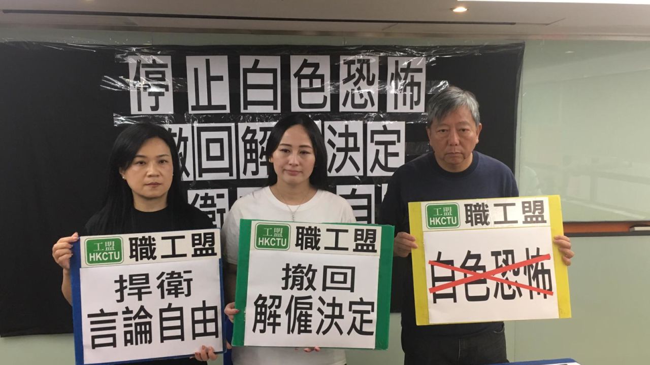 Former Cathay Dragon employee Rebecca Sy, center, with Hong Kong labor organizers on Friday.