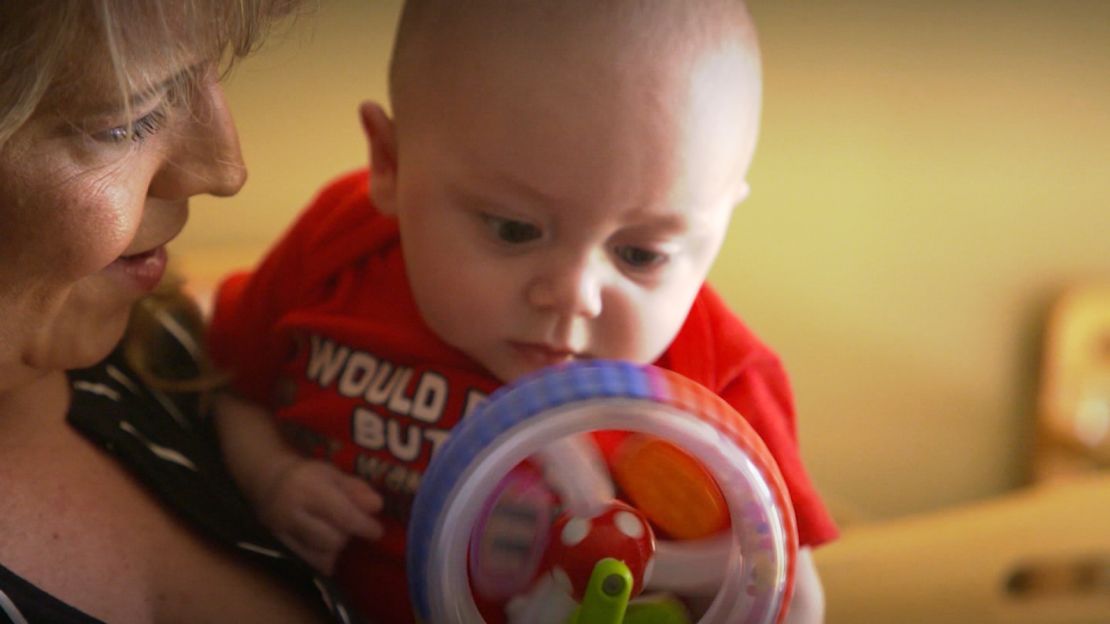 A caretaker holds an infant at a child care center in Huntington, West Virginia, for babies who were exposed to opioids in the womb. 