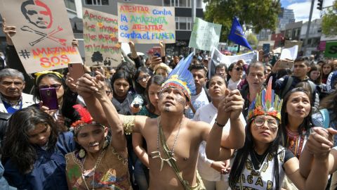 Colombian natives and activists protest against the government of Brazilian President Jair Bolsonaro over the fires in the Amazon rainforest.